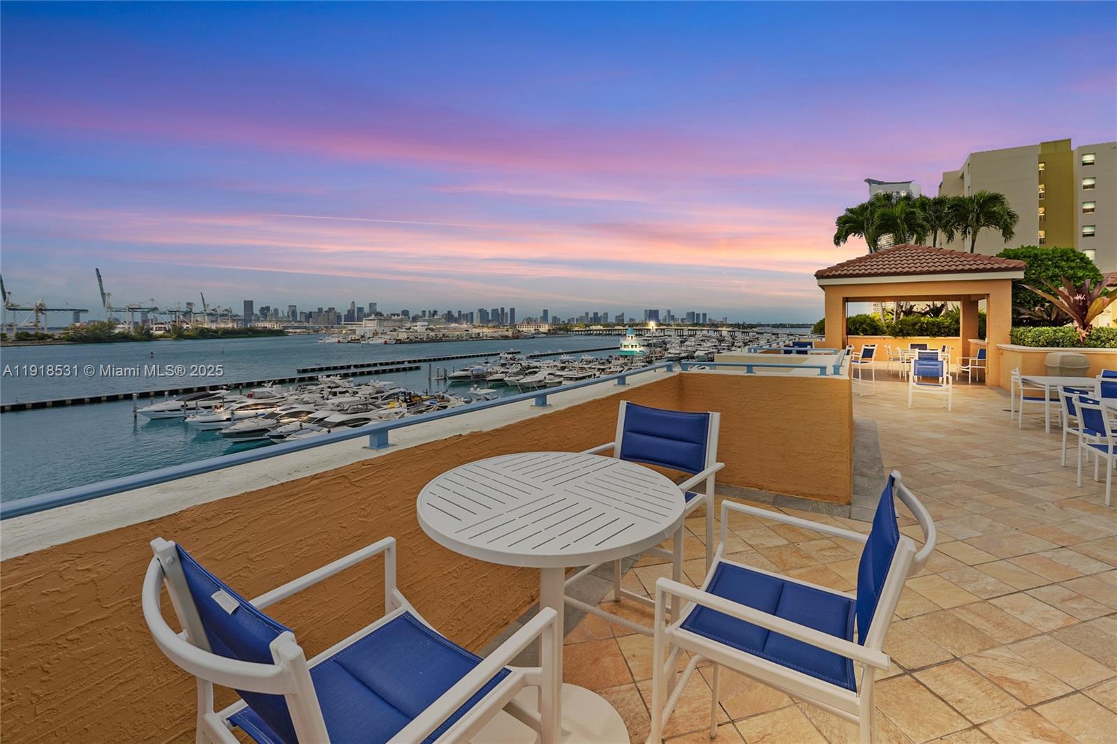 90 Alton Road, Unit 1209 Miami Beach, FL 33139 - Photo 15 of 44 a view of a chairs and table in the terrace