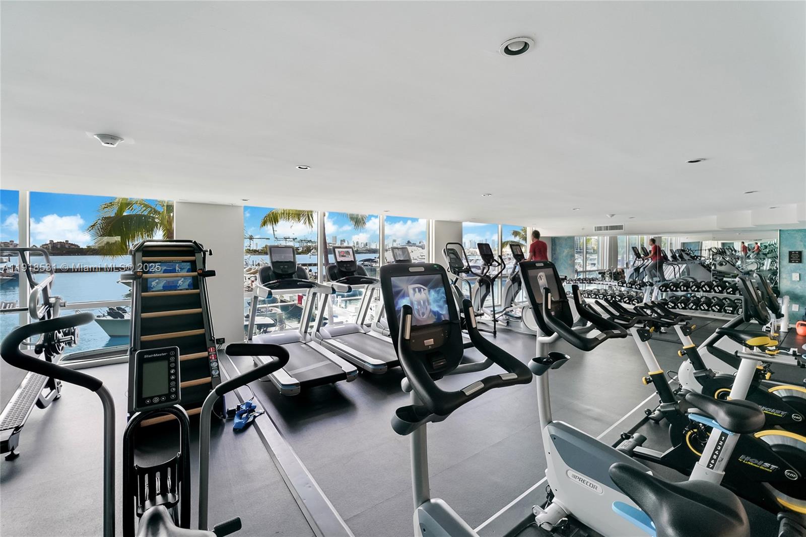 90 Alton Road, Unit 1209 Miami Beach, FL 33139 - Photo 17 of 44 a view of a room with gym equipment