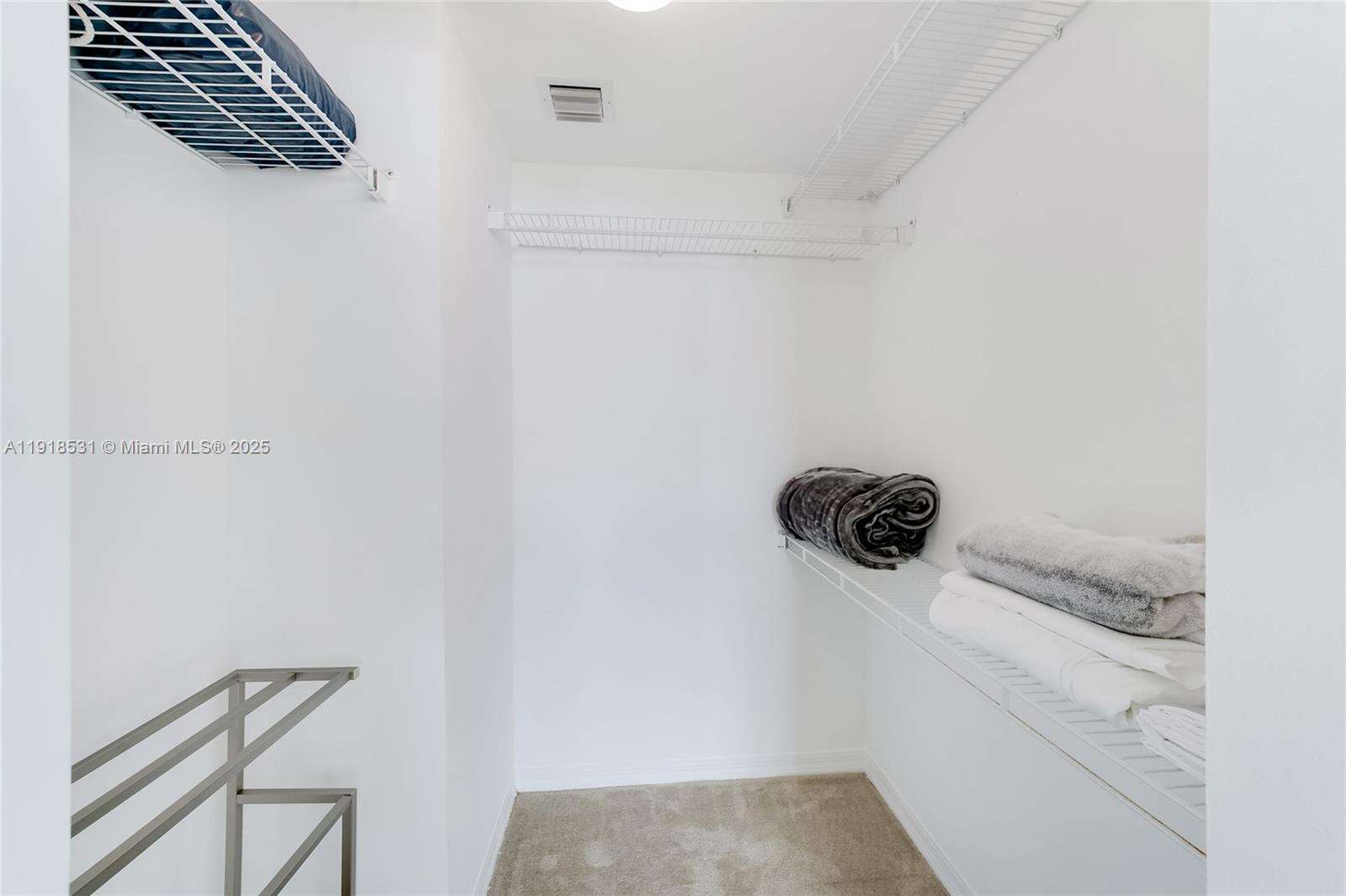 90 Alton Road, Unit 1209 Miami Beach, FL 33139 - Photo 36 of 44 a close view of a utility room with dryer and washer