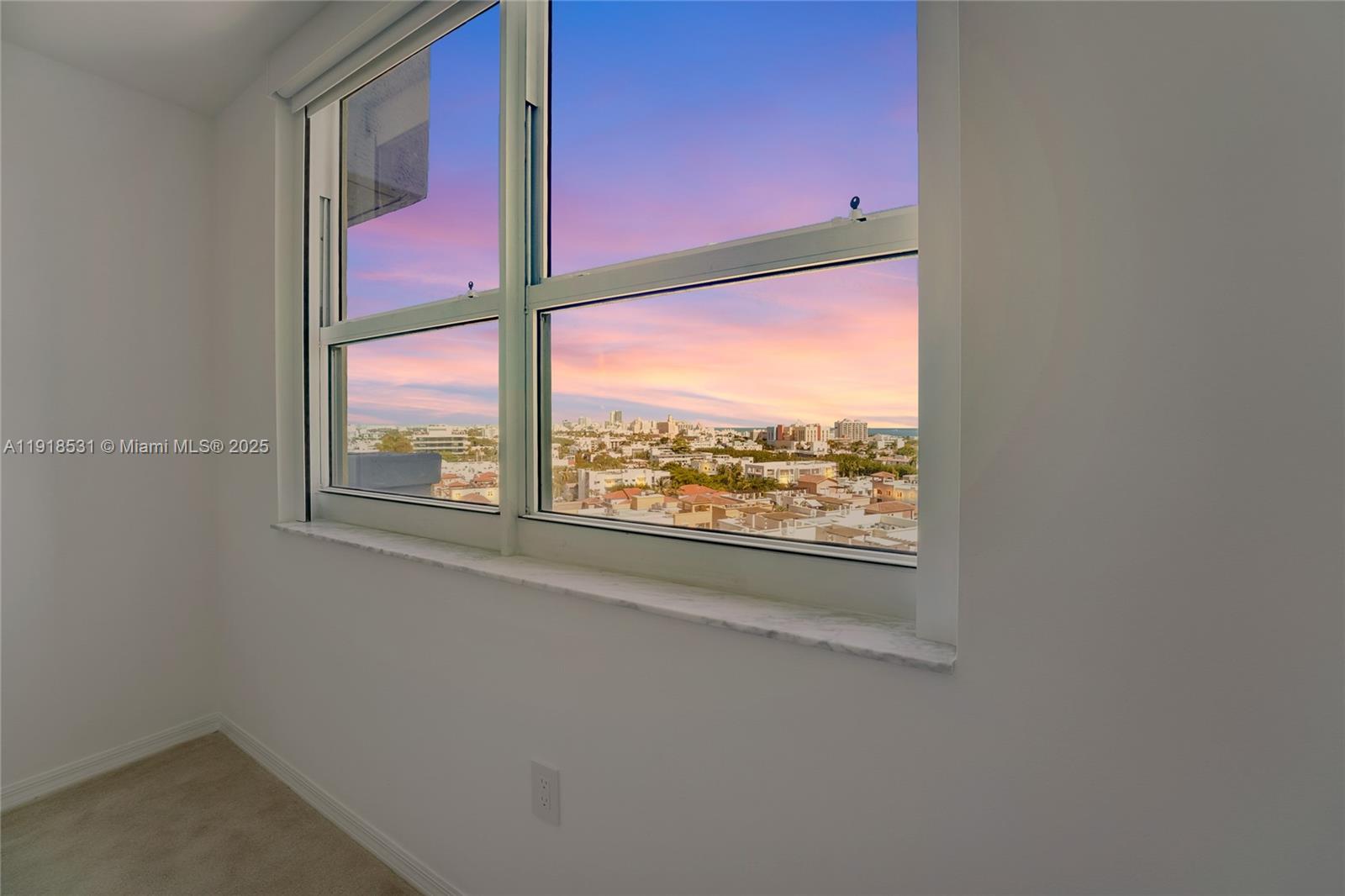 90 Alton Road, Unit 1209 Miami Beach, FL 33139 - Photo 40 of 44 an empty room with windows