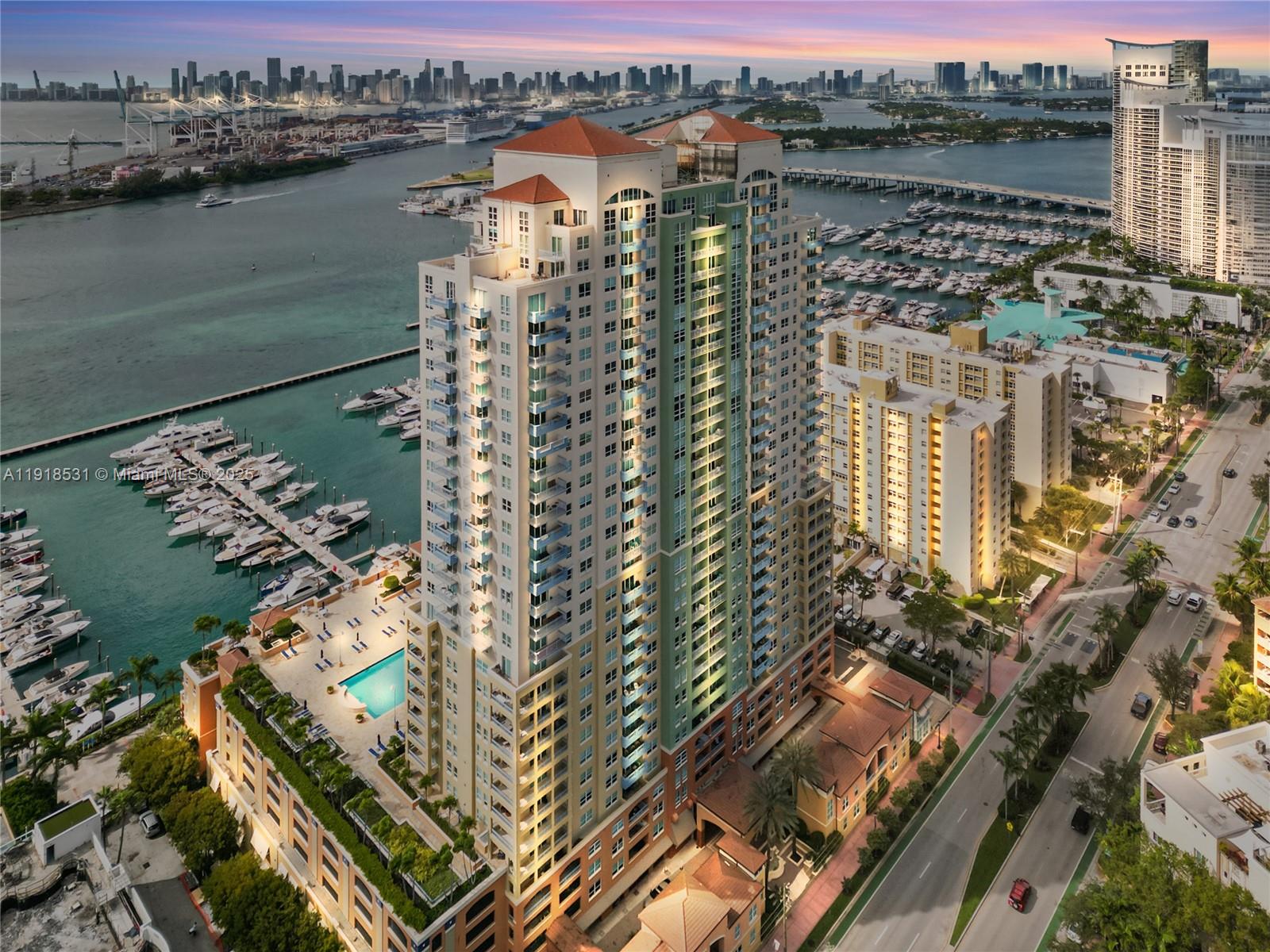 90 Alton Road, Unit 1209 Miami Beach, FL 33139 - Photo 6 of 44 a view of a lake with a city skyline in the background