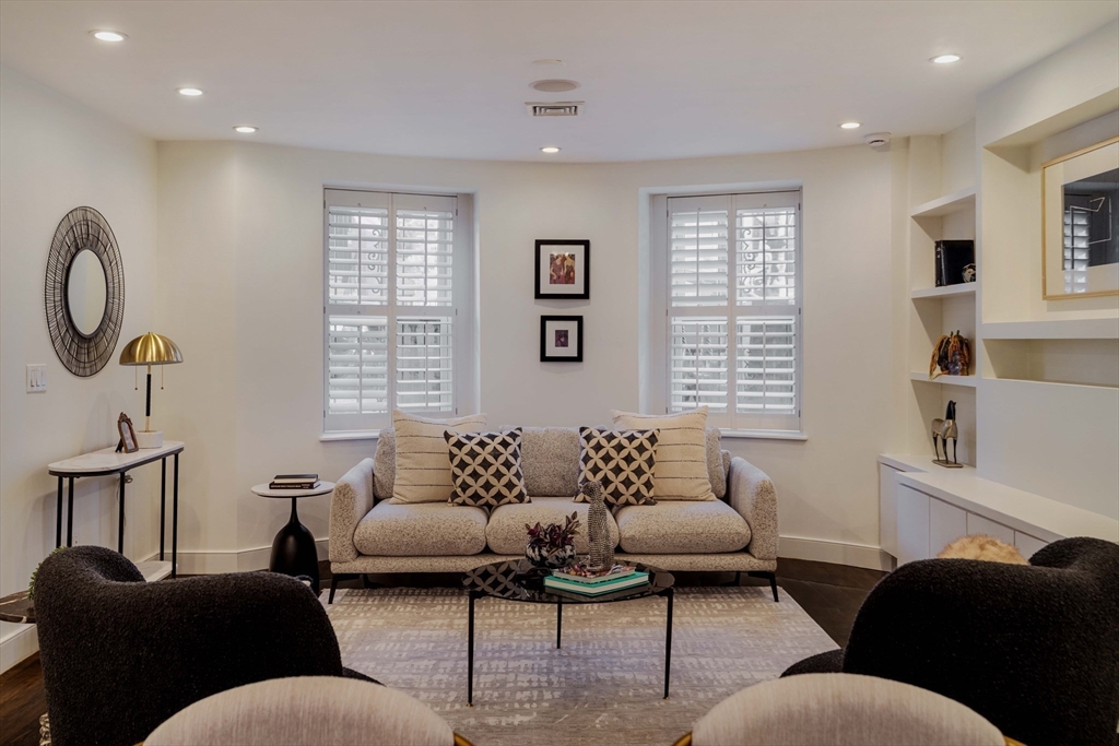 92 Waltham Street, Unit 1A Boston, MA 02118 - Photo 13 of 41 a living room with furniture and a window