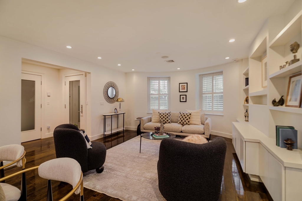 92 Waltham Street, Unit 1A Boston, MA 02118 - Photo 16 of 41 a living room with furniture ceiling fan and a wooden floor