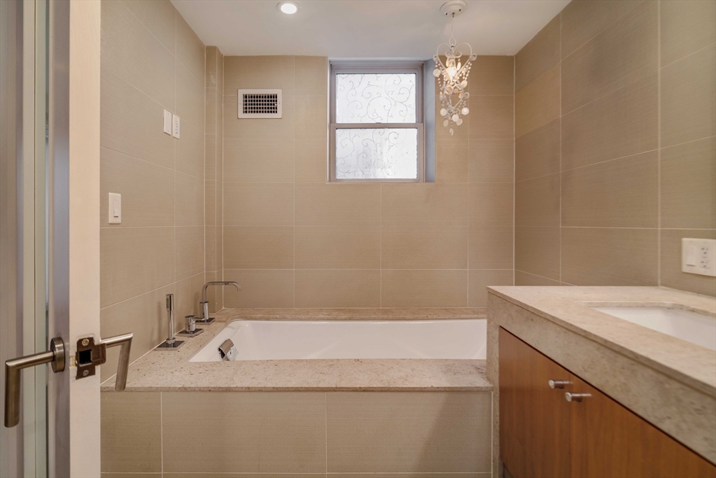 92 Waltham Street, Unit 1A Boston, MA 02118 - Photo 24 of 41 a bathroom with a sink and a bathtub