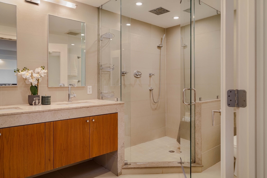 92 Waltham Street, Unit 1A Boston, MA 02118 - Photo 25 of 41 a bathroom with a shower sink and mirror