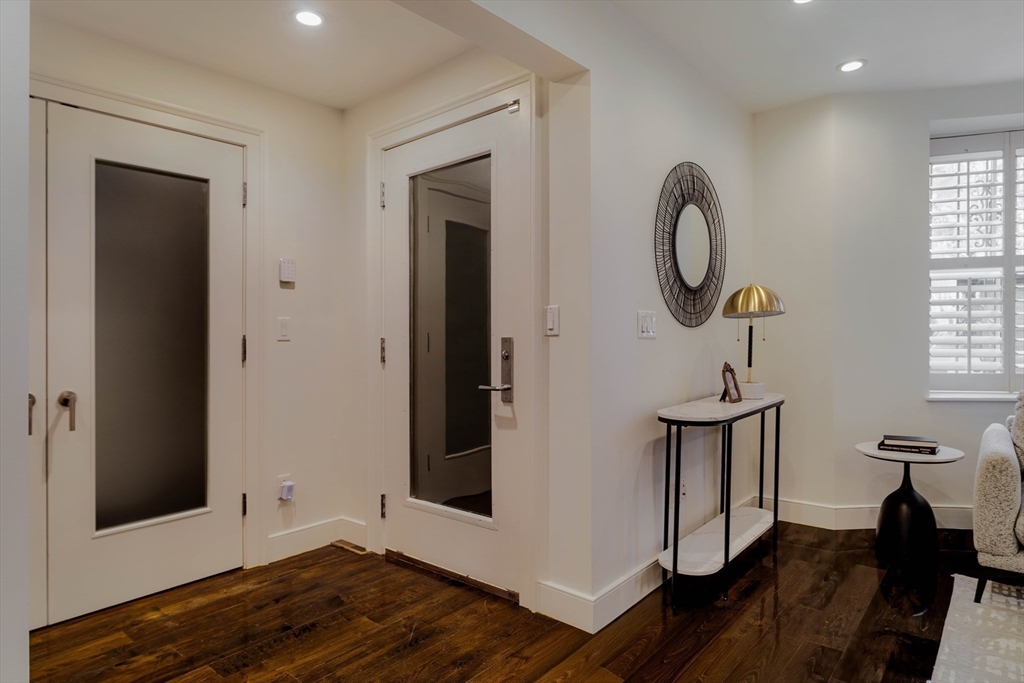 92 Waltham Street, Unit 1A Boston, MA 02118 - Photo 26 of 41 a view of a room with wooden floor and windows