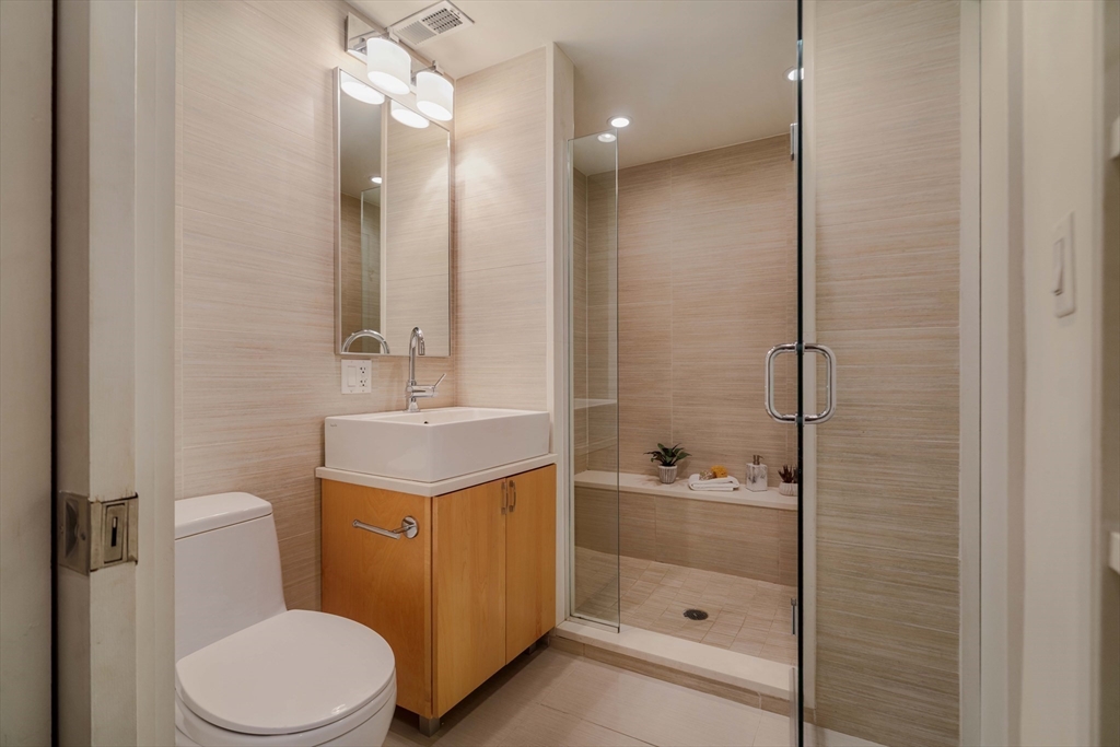 92 Waltham Street, Unit 1A Boston, MA 02118 - Photo 29 of 41 a bathroom with a sink a toilet and shower