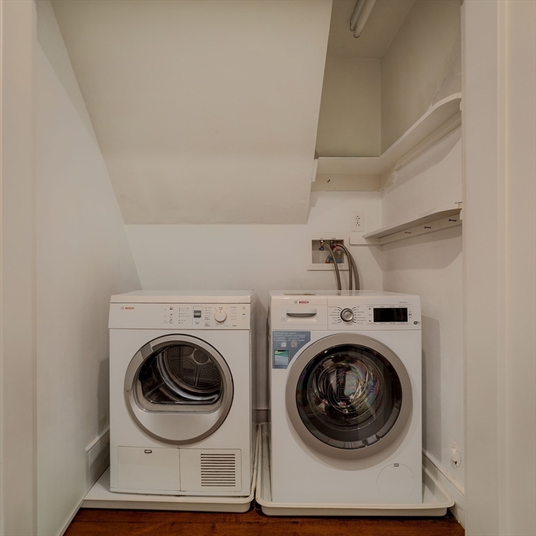 92 Waltham Street, Unit 1A Boston, MA 02118 - Photo 32 of 41 a utility room with dryer and washer