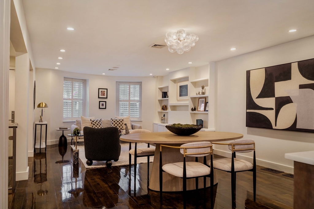 92 Waltham Street, Unit 1A Boston, MA 02118 - Photo 7 of 41 a view of a dining room with furniture and wooden floor