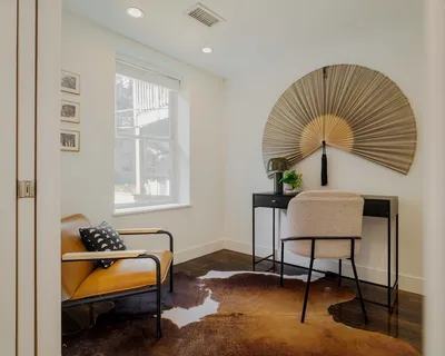 a bedroom with furniture and a window
