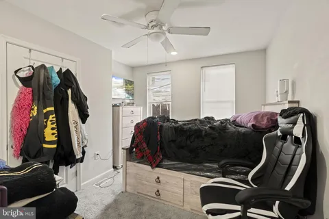 a bedroom with a bed and a walk in closet