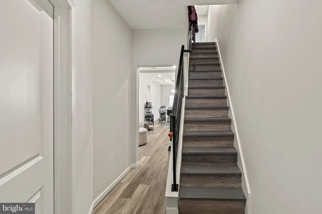 a view of entryway with wooden floor