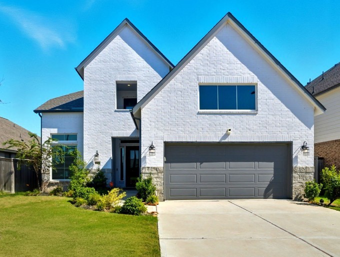 10438 Rigel Rdg Way Richmond, TX 77406 - Photo 1 of 34 a front view of a house with a yard and garage