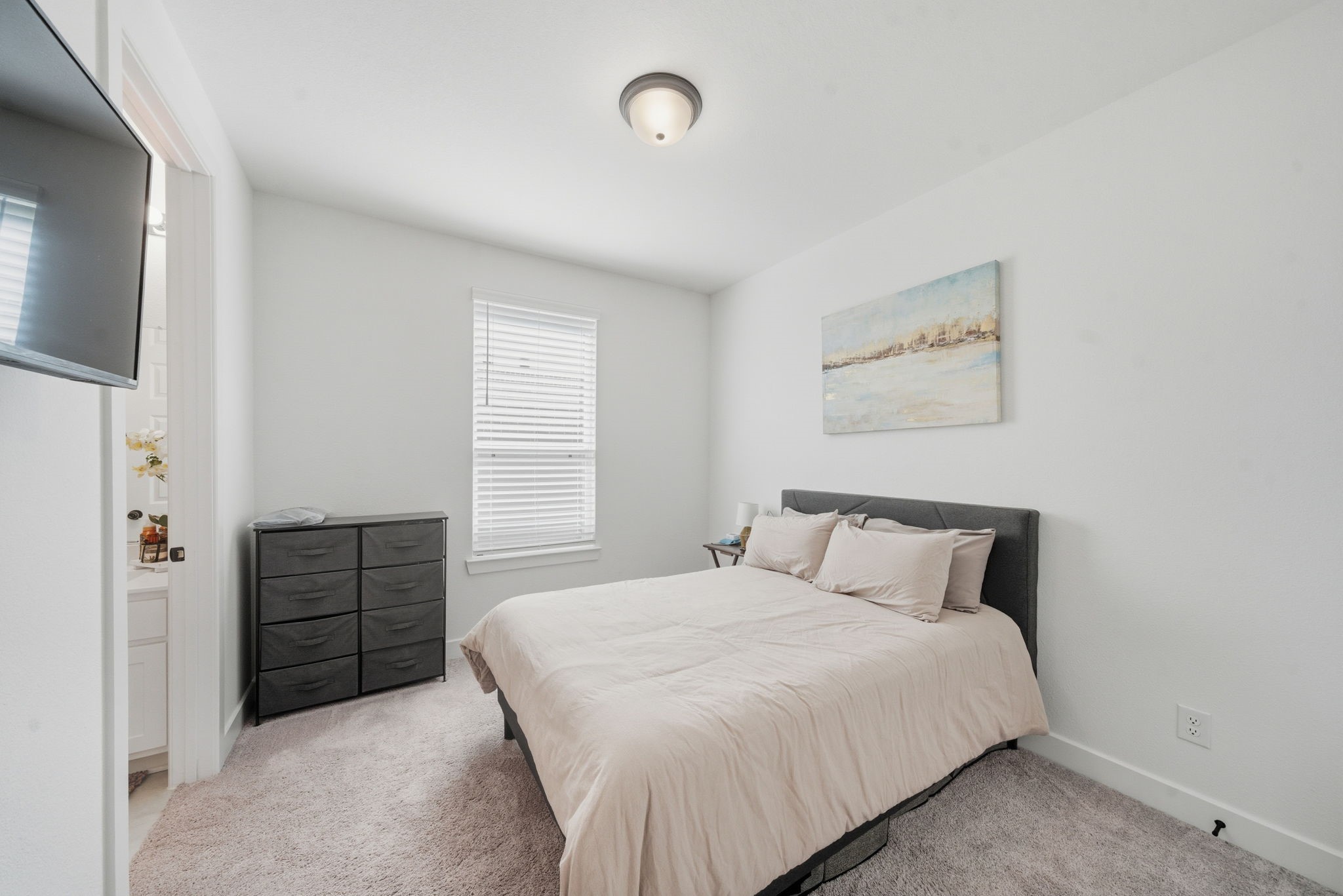 10438 Rigel Rdg Way Richmond, TX 77406 - Photo 18 of 34 a bedroom with a bed and cabinets