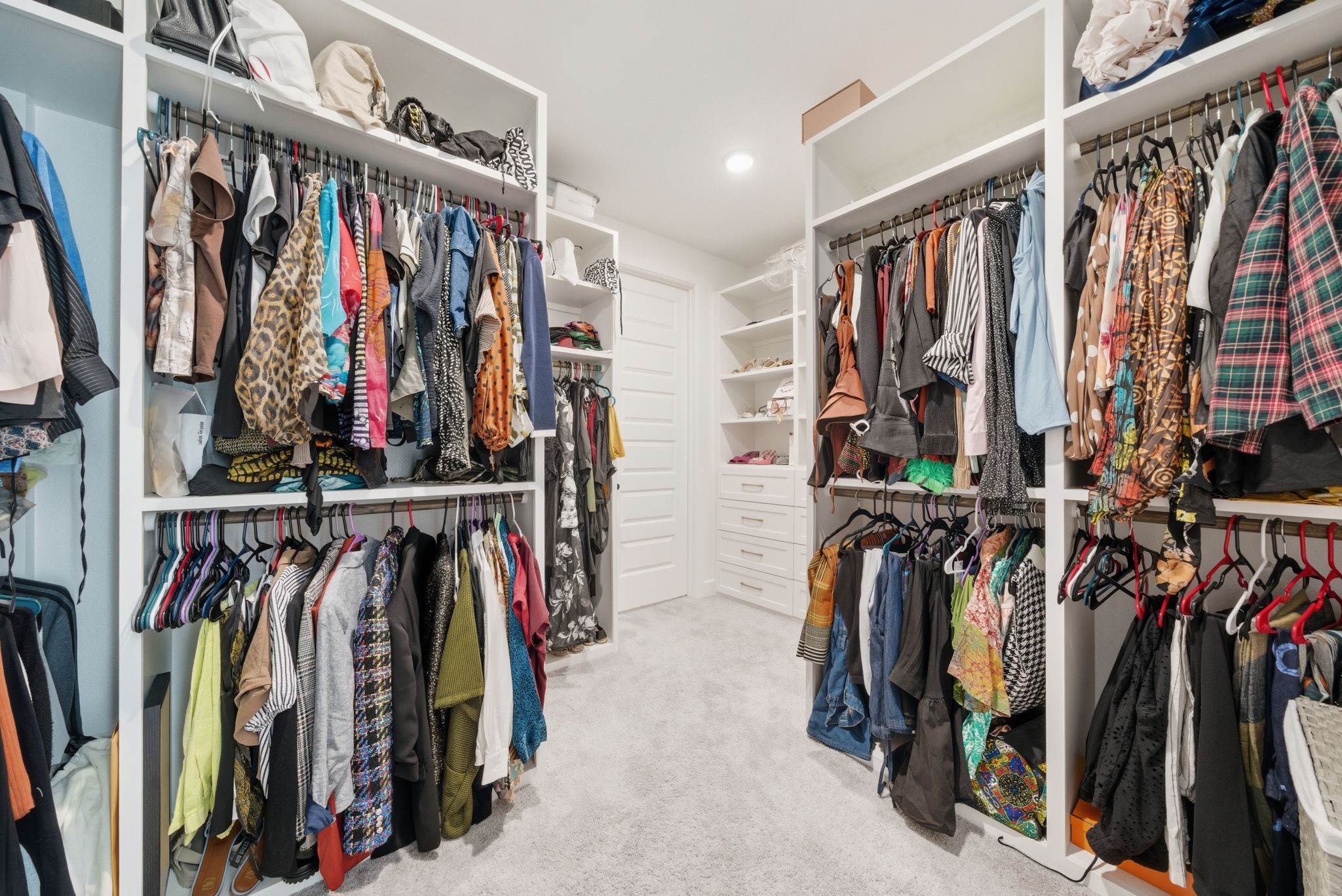 10438 Rigel Rdg Way Richmond, TX 77406 - Photo 23 of 34 a view of walk in closet with clothes