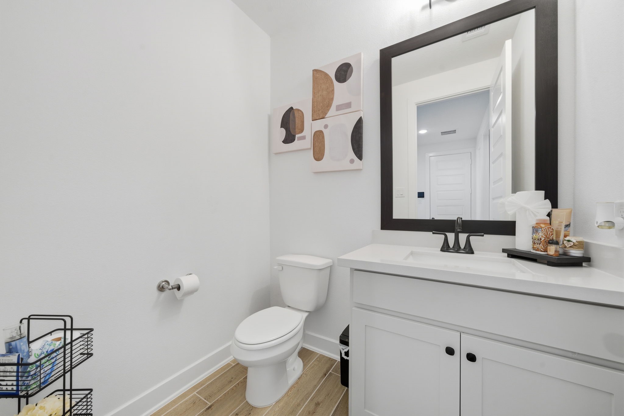 10438 Rigel Rdg Way Richmond, TX 77406 - Photo 25 of 34 a bathroom with a granite countertop sink mirror vanity and toilet