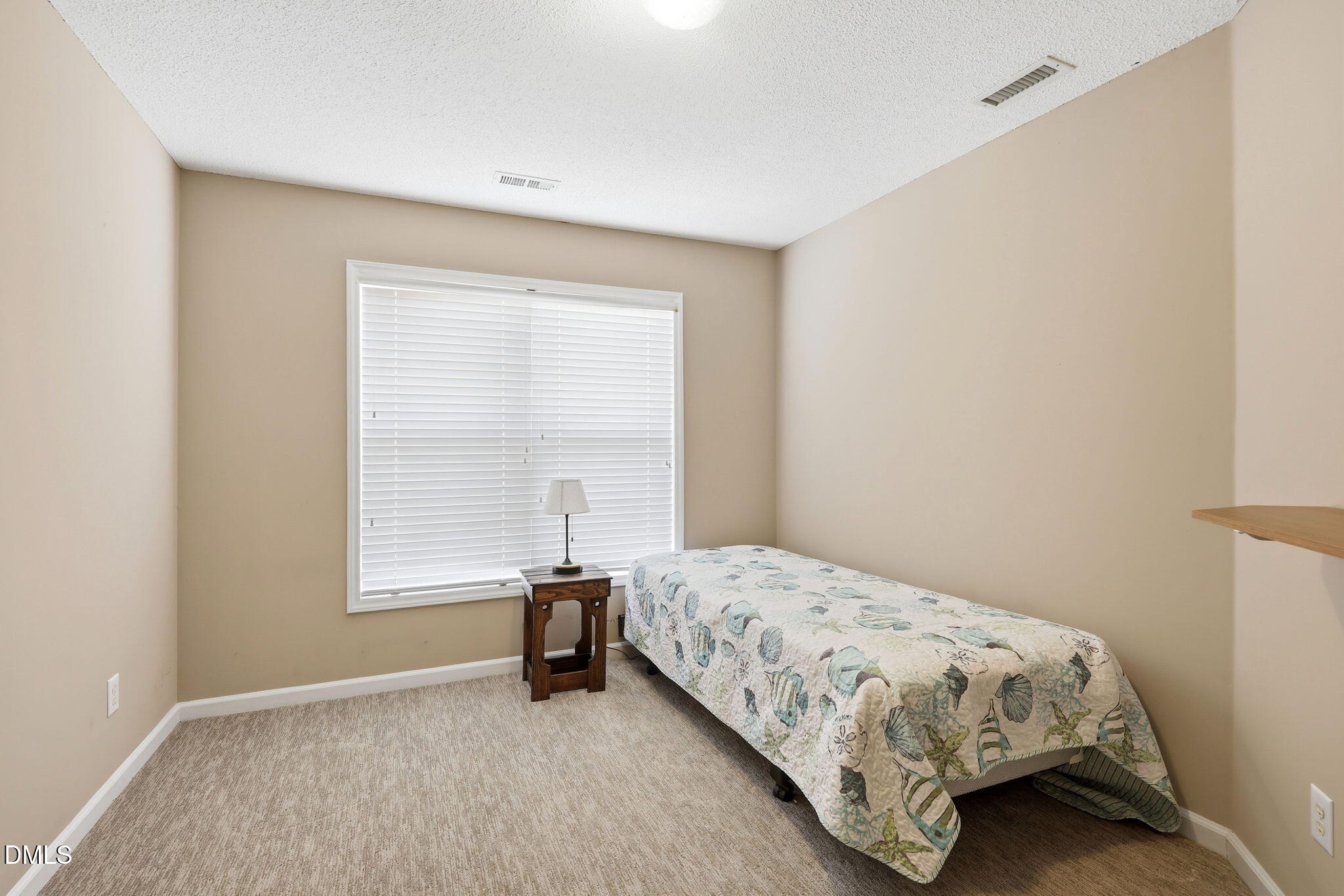 9105 Willow Valley Court Raleigh, NC 27617 - Photo 23 of 51 a bedroom with a bed and a window