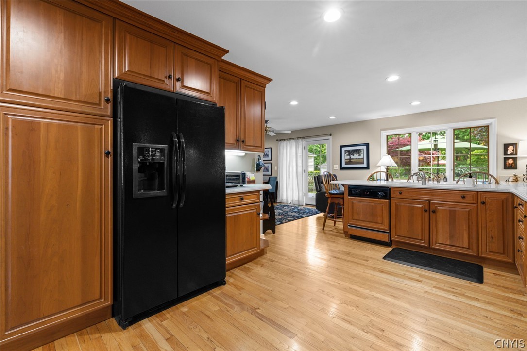410 Meadow Road Geddes, NY 13219 - Photo 14 of 50 The breakfast bar overlooks the picturesque backyard.