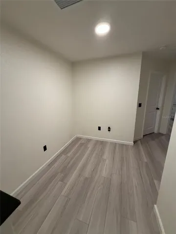 a bedroom with a bed and a chair