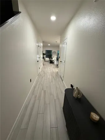 a bathroom with a glass door shower and toilet