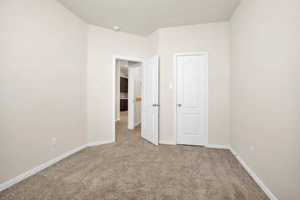 a bedroom with a bed and a ceiling fan
