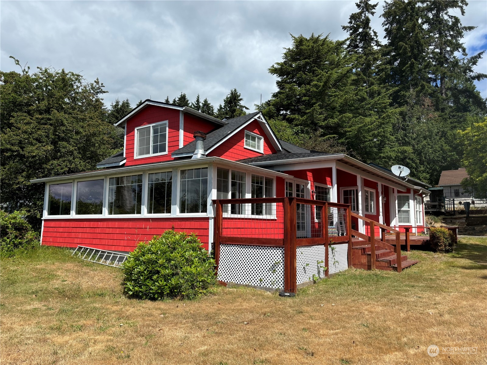 13809 Southwest Pohl Road Vashon, WA 98070 - Photo 1 of 1 a front view of a house with a yard balcony
