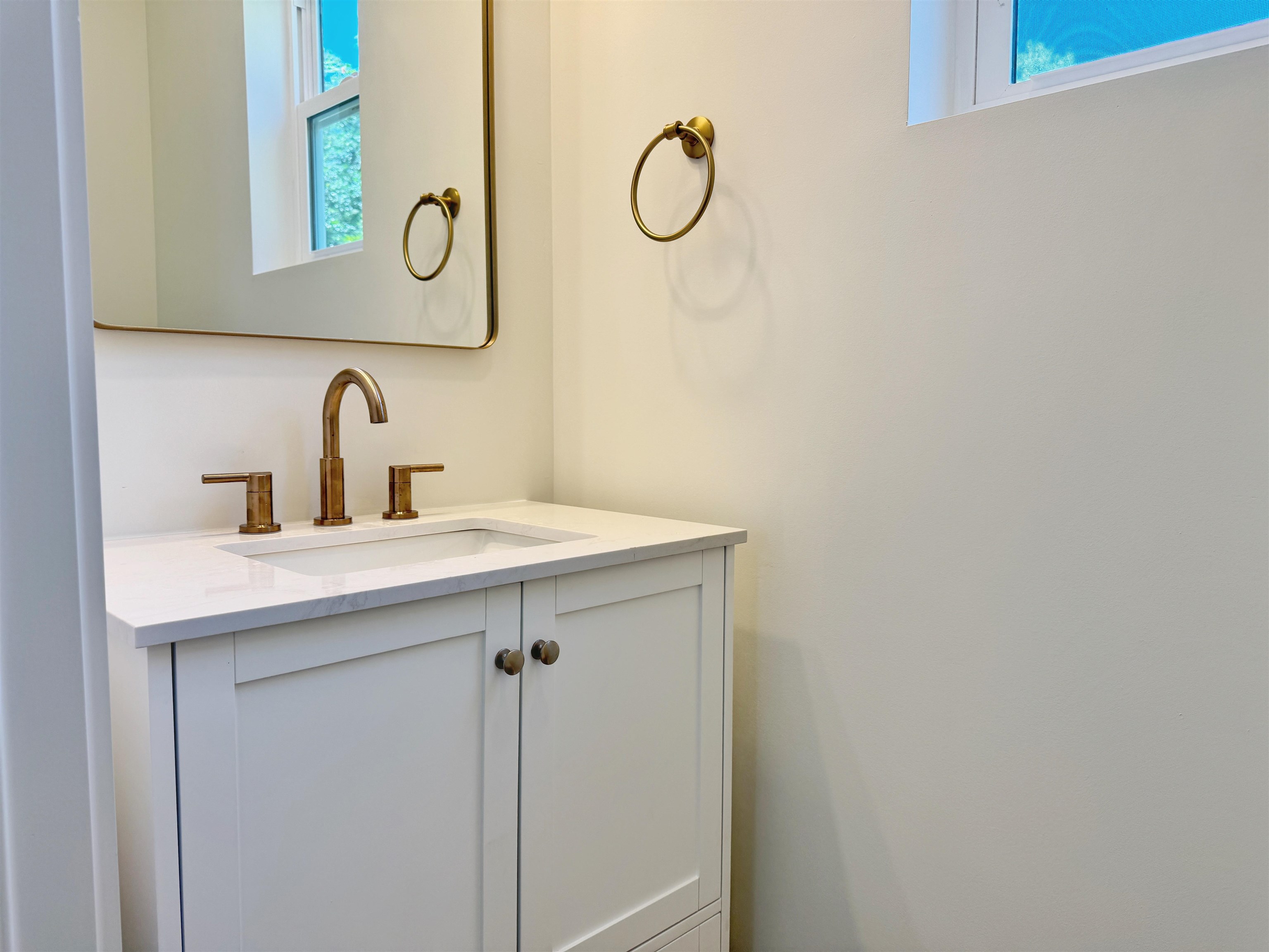 932 Alexander Street St. Augustine, FL 32084 - Photo 11 of 28 a bathroom with a sink and a mirror
