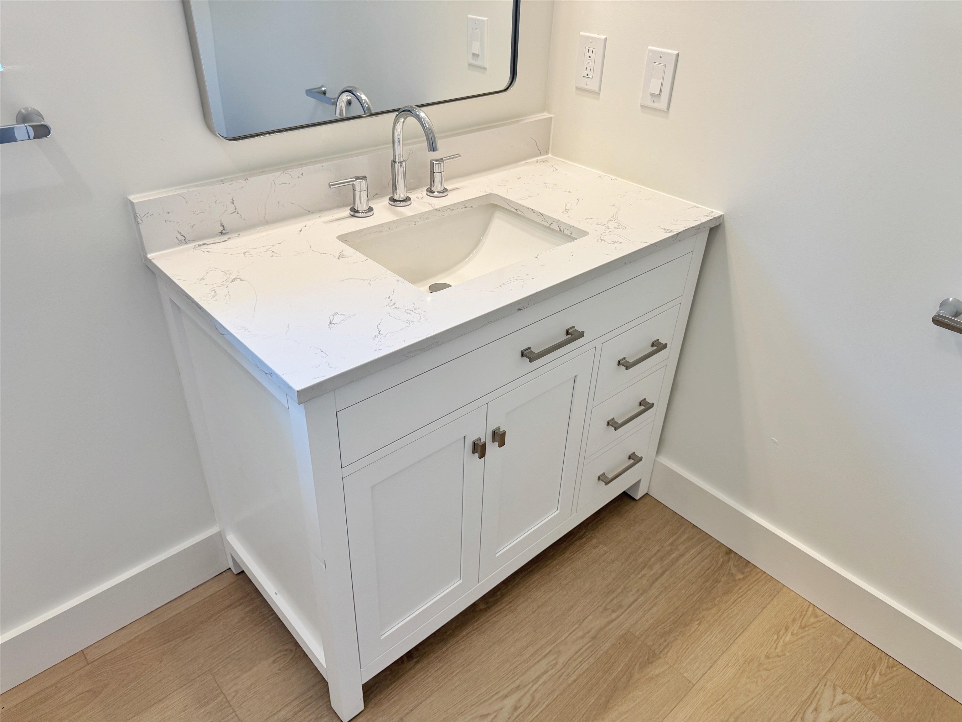 932 Alexander Street St. Augustine, FL 32084 - Photo 21 of 28 a bathroom with a sink and mirror