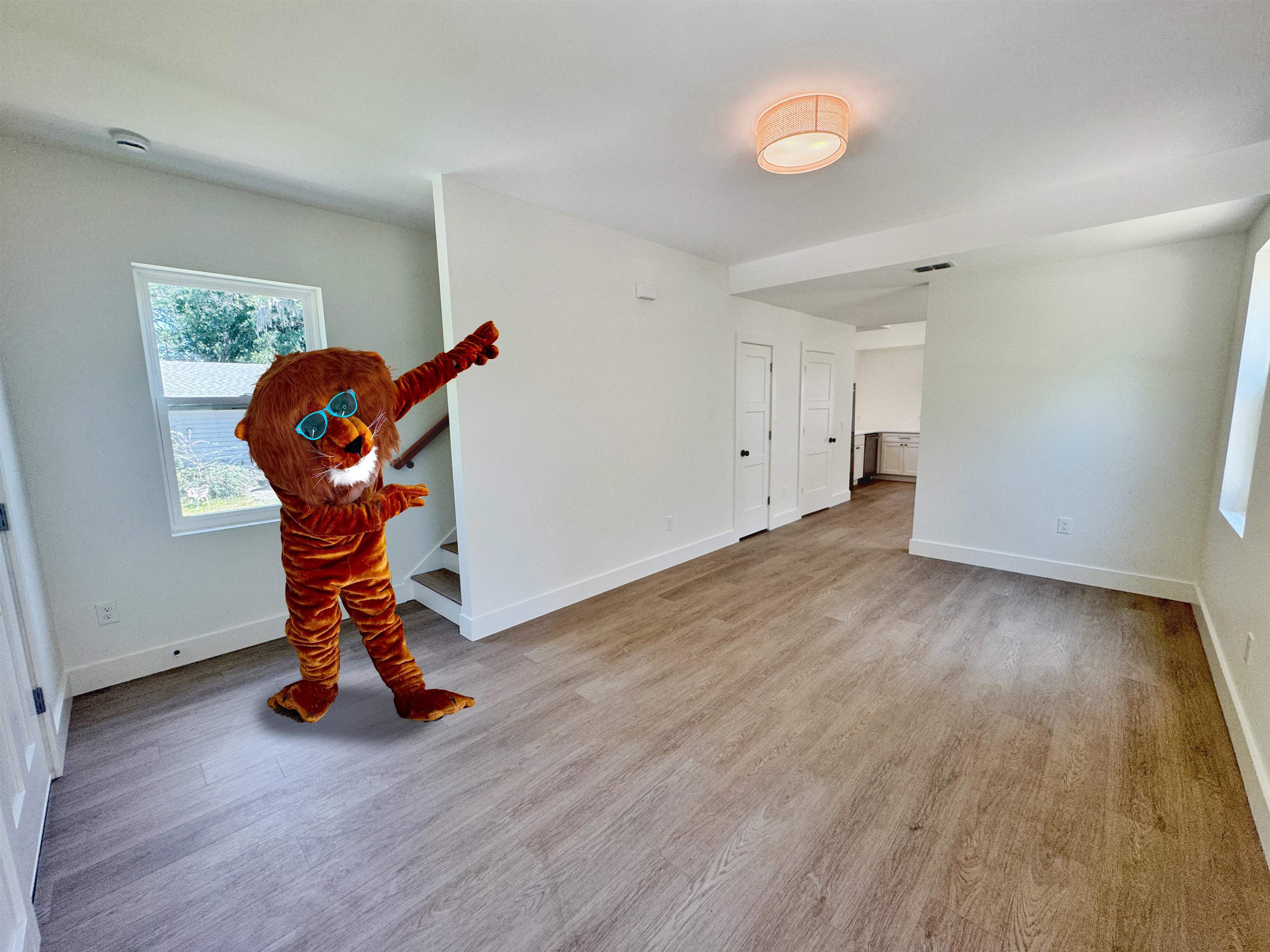 932 Alexander Street St. Augustine, FL 32084 - Photo 5 of 28 a view of an empty room with wooden floor and gym equipment