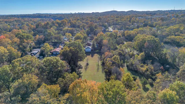 a view of a balcony with a yard and mountain view