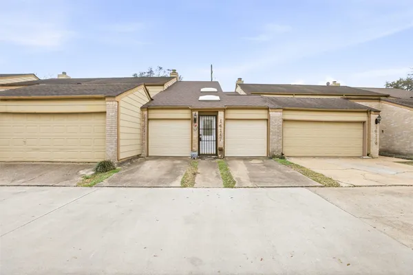 a view of pool with garage