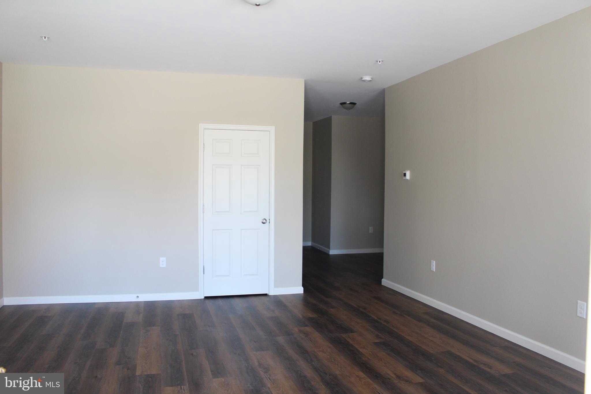 2560 Freysville Road, Unit B Red Lion, PA 17356 - Photo 2 of 6 a view of an empty room with wooden floor