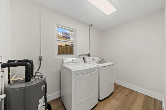 a utility room with a sink dryer and washer
