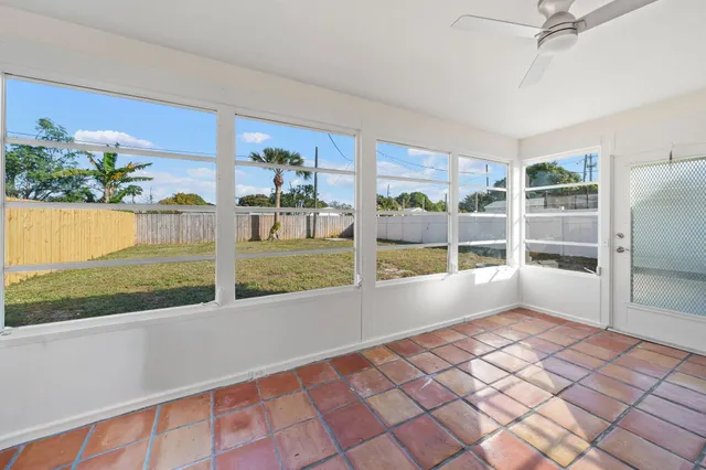 a view of a living room and a floor to ceiling window
