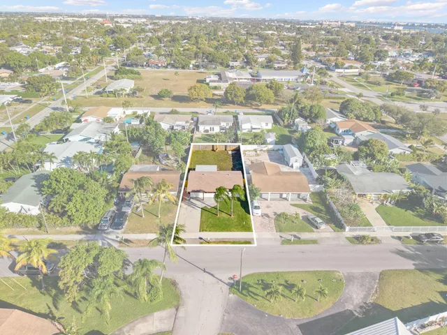 an aerial view of residential houses with outdoor space