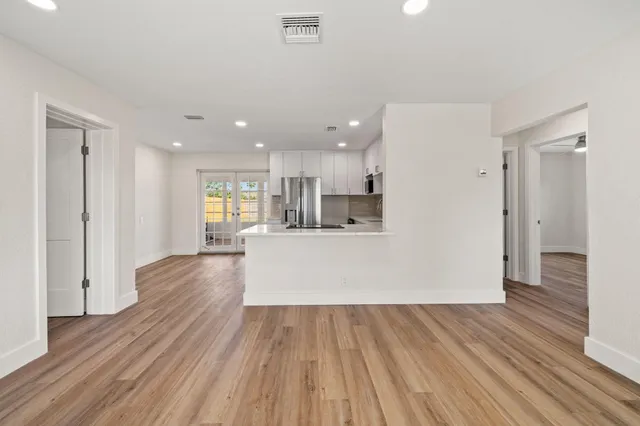 a view of kitchen and wooden floor