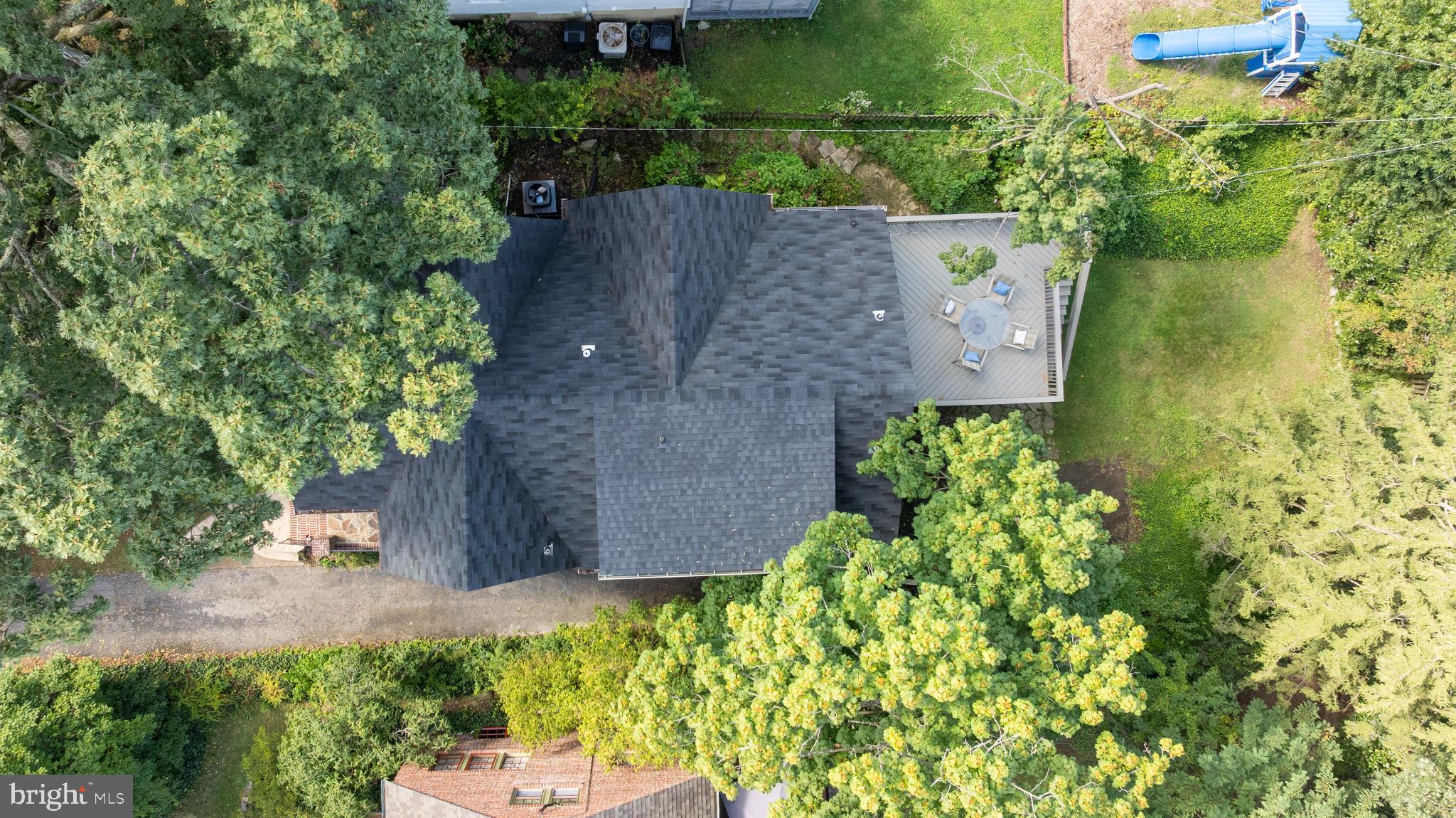 710 Anneslie Road Baltimore, MD 21212 - Photo 51 of 56 Lush greenery surrounds a charming home.