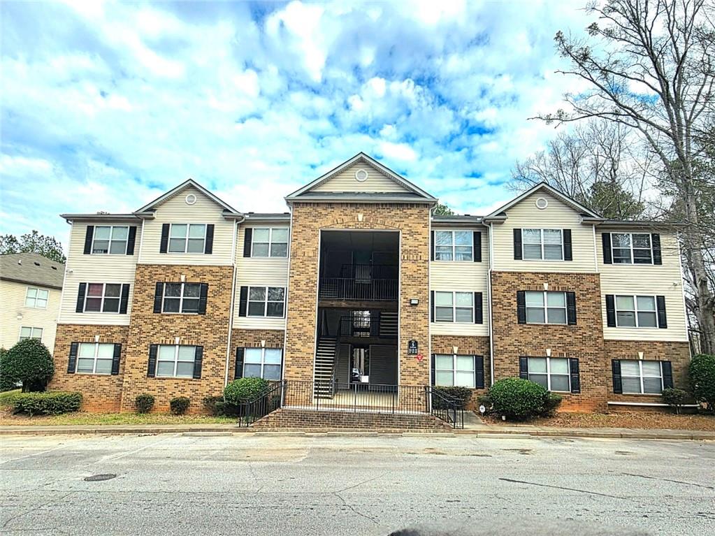 5303 Par 4 Way Lithonia, GA 30038 - Photo 1 of 28 a view of a brick house with a large windows