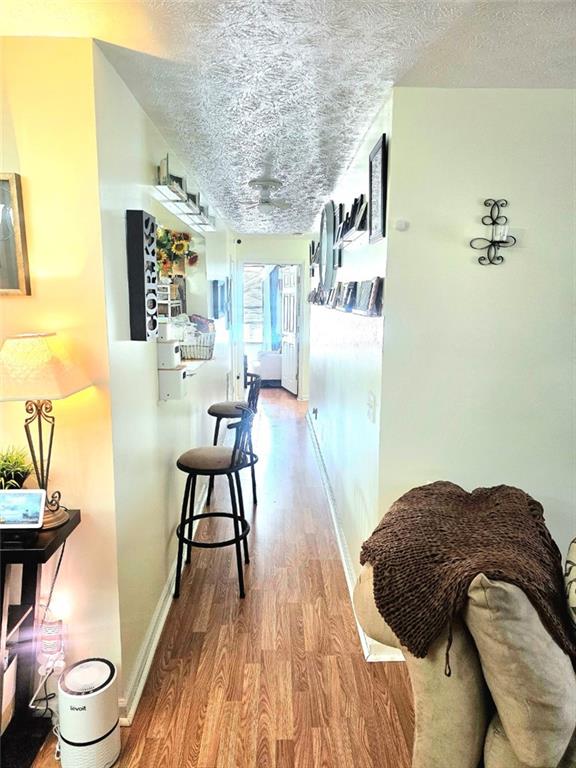 5303 Par 4 Way Lithonia, GA 30038 - Photo 14 of 28 a living room with a bed and a wooden floor