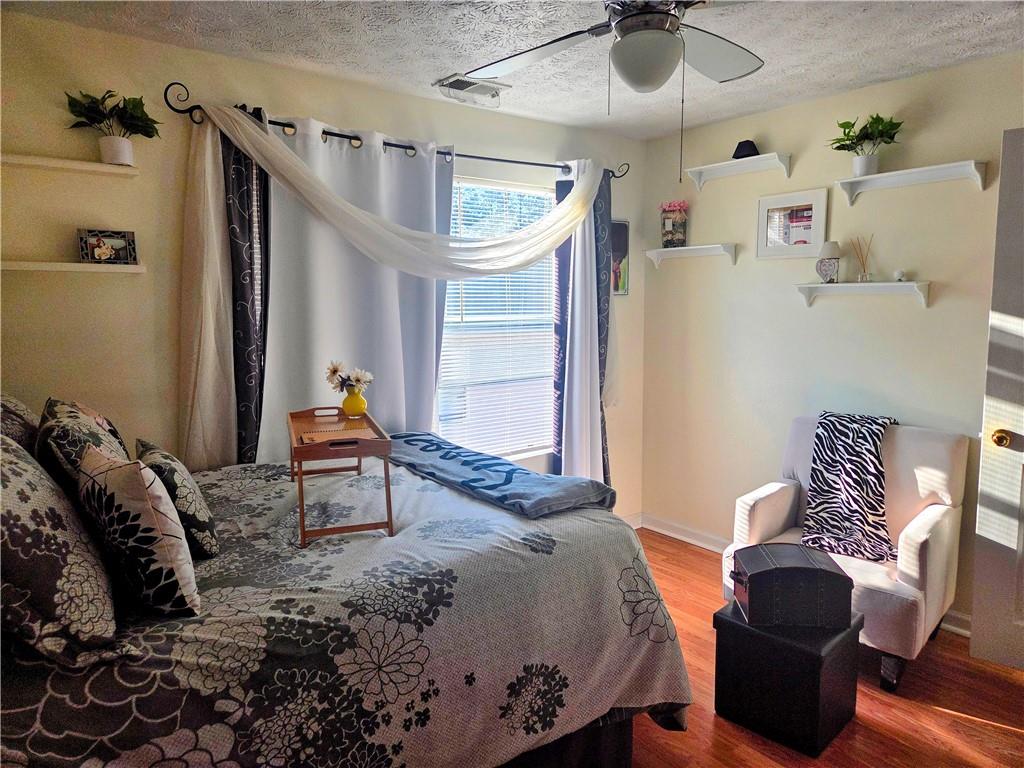 5303 Par 4 Way Lithonia, GA 30038 - Photo 16 of 28 a bedroom with furniture and a ceiling fan