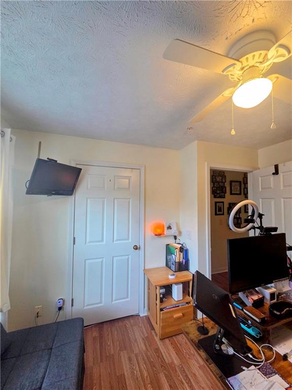 5303 Par 4 Way Lithonia, GA 30038 - Photo 21 of 28 a workspace with furniture and wooden floor