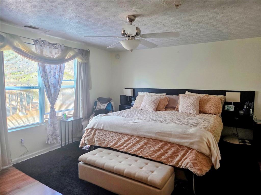 5303 Par 4 Way Lithonia, GA 30038 - Photo 23 of 28 a bedroom with a bed and window