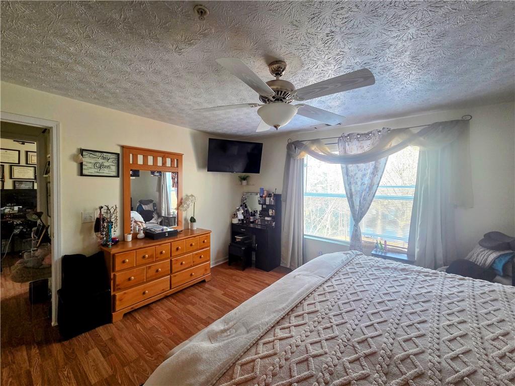 5303 Par 4 Way Lithonia, GA 30038 - Photo 25 of 28 a bed room with a bed and a large window