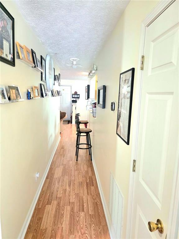5303 Par 4 Way Lithonia, GA 30038 - Photo 26 of 28 a view of a living room with furniture and wooden floor