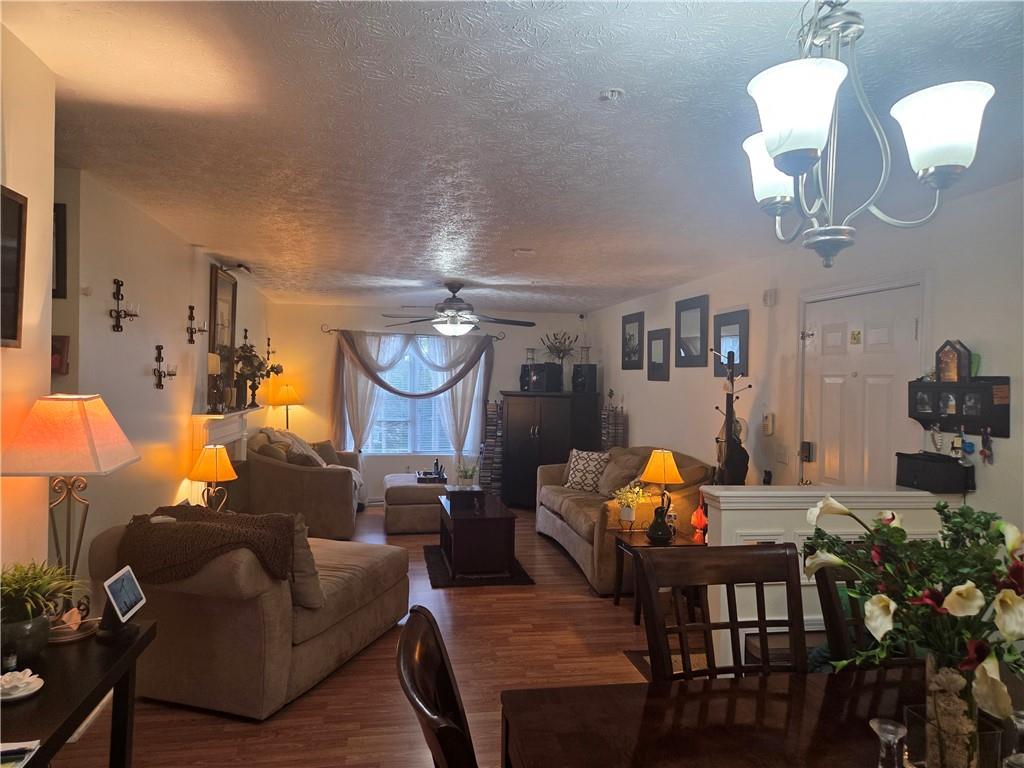 5303 Par 4 Way Lithonia, GA 30038 - Photo 5 of 28 a living room with furniture kitchen view and a chandelier