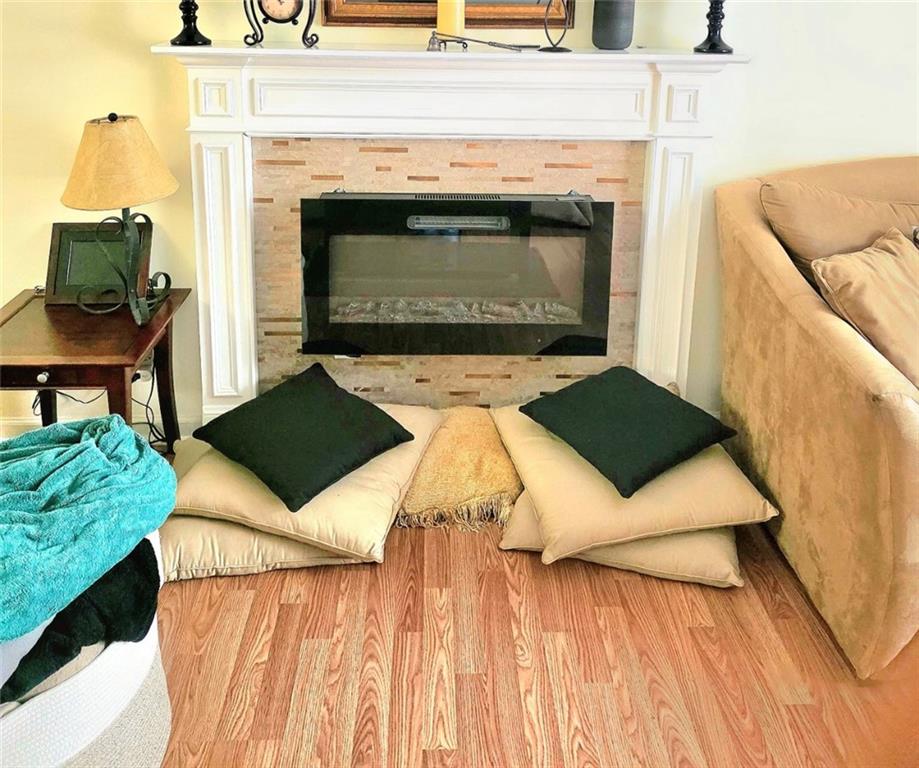 5303 Par 4 Way Lithonia, GA 30038 - Photo 7 of 28 a living room with furniture and a fireplace