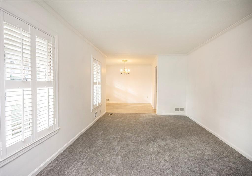 3935 Orchard Road Southeast Smyrna, GA 30080 - Photo 7 of 14 a view of an empty room with a window