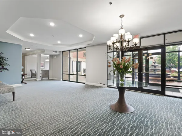 a view of a room with lots of wooden furniture