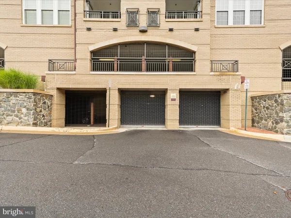 a front view of a building with a garage