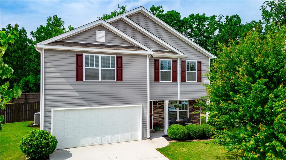 34 Karkinnen Court Pendleton, SC 29670 - Photo 2 of 36 Well-maintained exterior with vibrant landscaping, showcasing a practical driveway and inviting front entry.